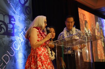 MEDB’s Leslie Wilkins (Present & CEO) and Curtis Tom (Education Chair), congratulate a surprised Renezel Lagran (pictured in the middle) on her receiving the 2017 Daniel K. Inouye Innovation Award.